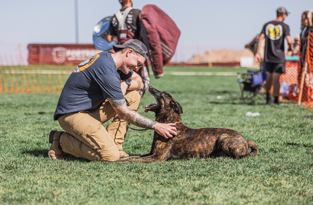 Handler with dog at trial